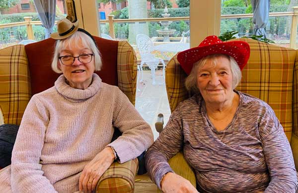 Two of Heathfield's residents wearing cowboy hats