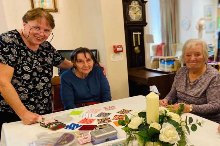 A crafts session for the Heathfield residents with paints and flowers