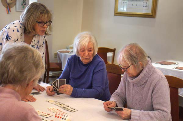 A group of Heathfield ladies around a card table