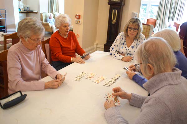 A game of cards with Louise, one of Heathfield's owners