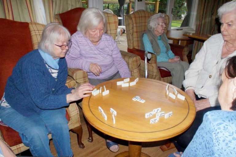 Some of Heathfield's residents play dominoes