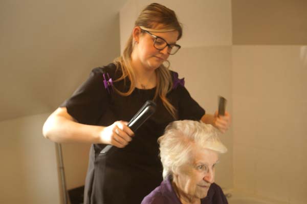 A hairdresser visits Heathfield to attend to the clients